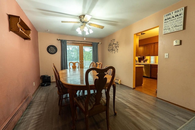 105 Glenview Dr, Tomah, WI 54660 - dining room with a baseboard heating unit, wood finished floors, a ceiling fan, and french doors