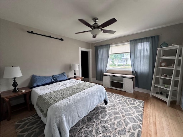 403 Dwight St, Chippewa Falls, WI 54729 - bedroom with wood finished floors, a ceiling fan, and baseboards
