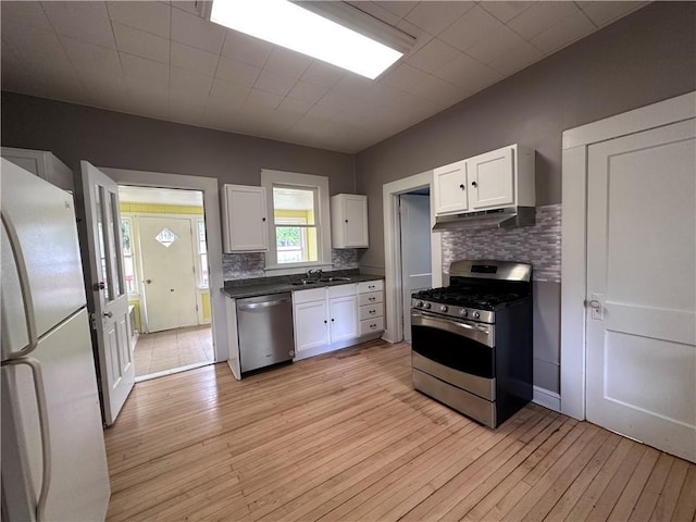 403 Dwight St, Chippewa Falls, WI 54729 - kitchen featuring appliances with stainless steel finishes, white cabinetry, and light wood-type flooring