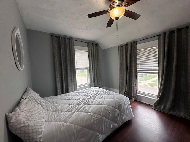 403 Dwight St, Chippewa Falls, WI 54729 - bedroom featuring vaulted ceiling, dark wood-style floors, a ceiling fan, and a textured ceiling