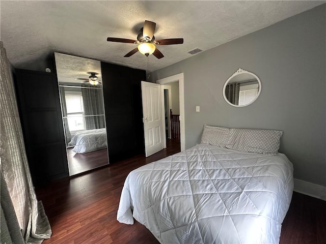 403 Dwight St, Chippewa Falls, WI 54729 - bedroom featuring wood finished floors, a textured ceiling, ceiling fan, and baseboards