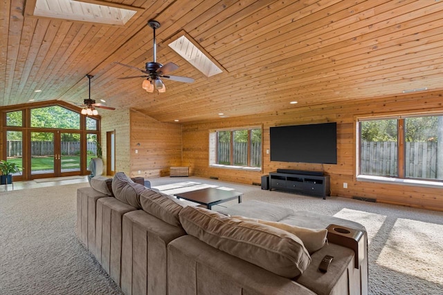 4531 Tabor Rd, Racine, WI 53402 - carpeted living area with a skylight, plenty of natural light, ceiling fan, wood walls, and wood ceiling
