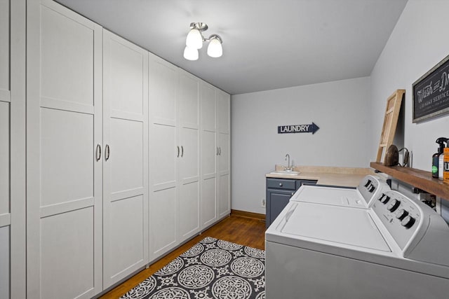 4531 Tabor Rd, Racine, WI 53402 - laundry area featuring independent washer and dryer, cabinet space, dark wood finished floors, and baseboards
