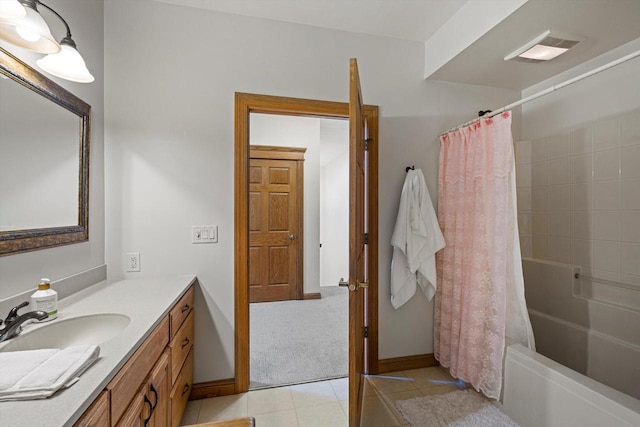 4531 Tabor Rd, Racine, WI 53402 - full bathroom with tile patterned floors, vanity, shower / bath combo, and baseboards