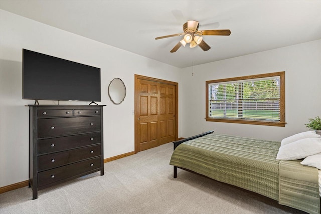 4531 Tabor Rd, Racine, WI 53402 - bedroom with light colored carpet, baseboards, a ceiling fan, and a closet
