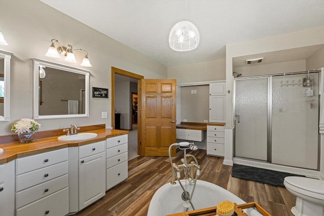 4531 Tabor Rd, Racine, WI 53402 - full bath with a shower stall, wood finished floors, a soaking tub, and vanity