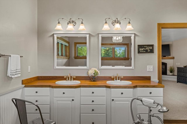 4531 Tabor Rd, Racine, WI 53402 - full bath with double vanity and a brick fireplace