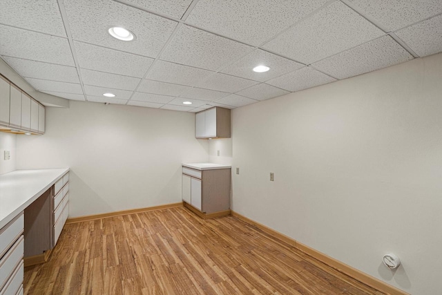 4531 Tabor Rd, Racine, WI 53402 - kitchen featuring light wood finished floors, light countertops, a paneled ceiling, baseboards, and recessed lighting