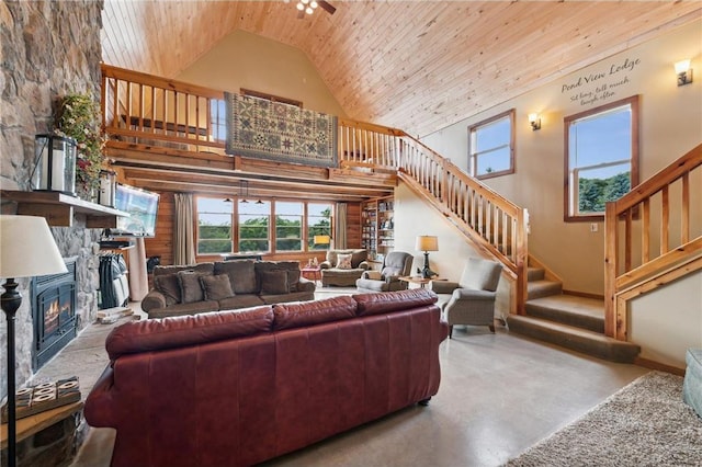 2929 170th St, Frederic, WI 54837 - living area featuring stairs, wood ceiling, high vaulted ceiling, a fireplace, and carpet flooring