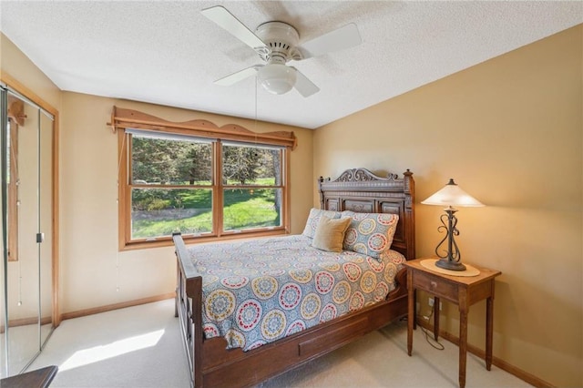 2929 170th St, Frederic, WI 54837 - carpeted bedroom featuring baseboards, a textured ceiling, ceiling fan, and a closet