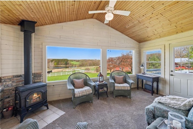 2929 170th St, Frederic, WI 54837 - sunroom featuring vaulted ceiling, a wood stove, and a water view