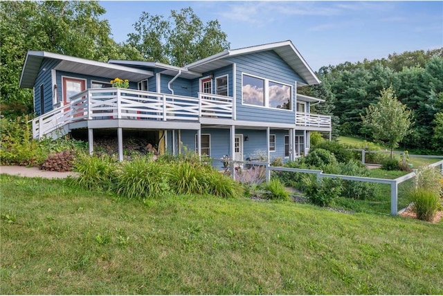 2929 170th St, Frederic, WI 54837 - rear view of property featuring a wooden deck and a lawn