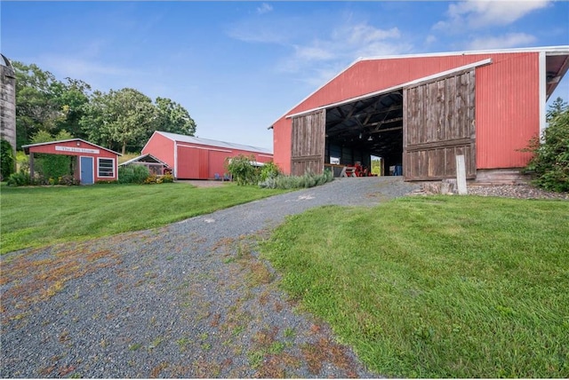 2929 170th St, Frederic, WI 54837 - view of pole building with a yard and driveway