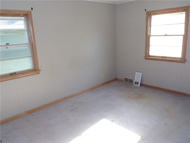 3212 Venus Ave, Eau Claire, WI 54703 - carpeted empty room featuring plenty of natural light and baseboards
