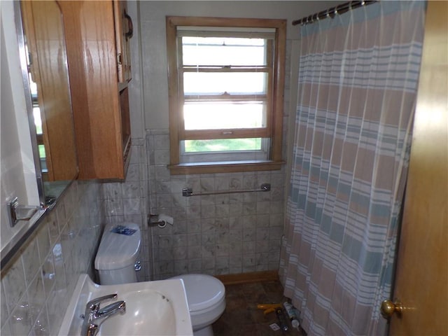 3212 Venus Ave, Eau Claire, WI 54703 - bathroom with a sink, toilet, healthy amount of natural light, tile walls, and a shower with shower curtain