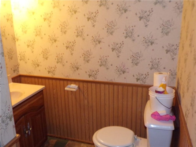 3212 Venus Ave, Eau Claire, WI 54703 - half bath featuring toilet, wainscoting, vanity, and wallpapered walls