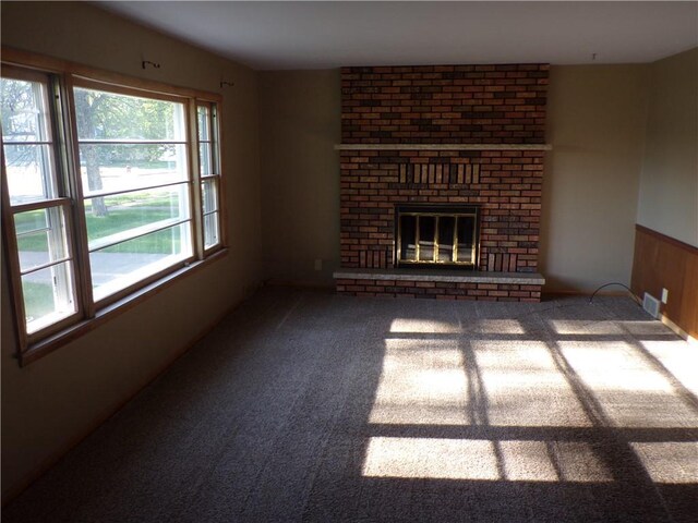 3212 Venus Ave, Eau Claire, WI 54703 - unfurnished living room featuring carpet floors and a brick fireplace