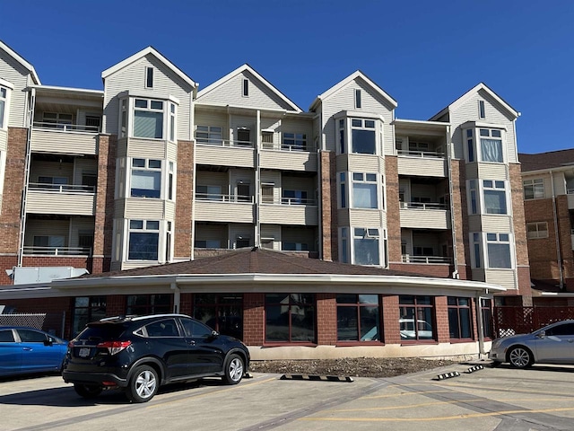 301 Harbour Town Dr Unit 227, Madison, WI 53717 - view of apartment building / complex featuring uncovered parking
