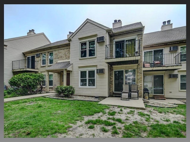 6710 Park Ridge Dr Unit B, Madison, WI 53719 - rear view of house with a patio area, a yard, a balcony, and a chimney
