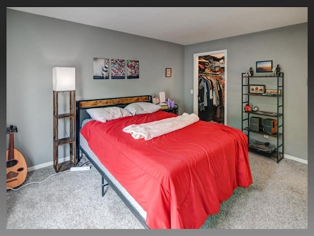 6710 Park Ridge Dr Unit B, Madison, WI 53719 - carpeted bedroom featuring a spacious closet, baseboards, and a closet