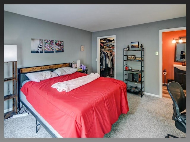 6710 Park Ridge Dr Unit B, Madison, WI 53719 - bedroom with carpet floors, a spacious closet, baseboards, and a closet