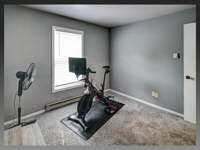 6710 Park Ridge Dr Unit B, Madison, WI 53719 - exercise room featuring baseboards, a baseboard radiator, and carpet