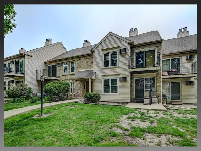 6710 Park Ridge Dr Unit B, Madison, WI 53719 - view of front of home with a front lawn and a balcony