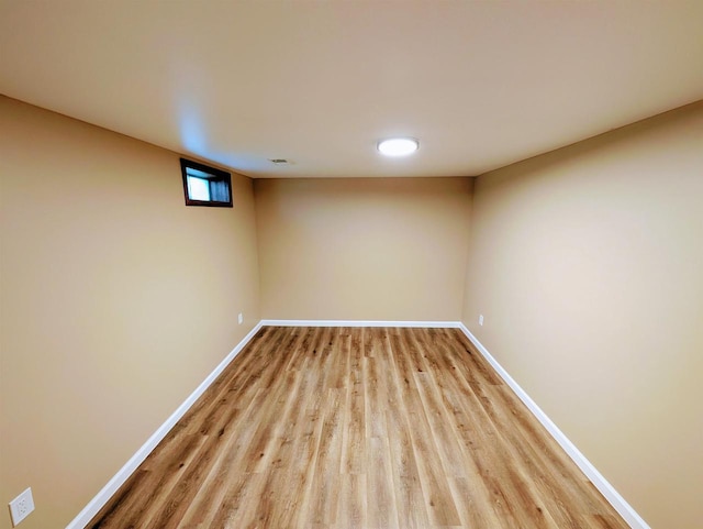 73 Church St, Montello, WI 53949 - below grade area featuring light wood-style floors and baseboards