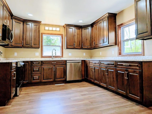 73 Church St, Montello, WI 53949 - kitchen featuring appliances with stainless steel finishes, healthy amount of natural light, light wood finished floors, and recessed lighting