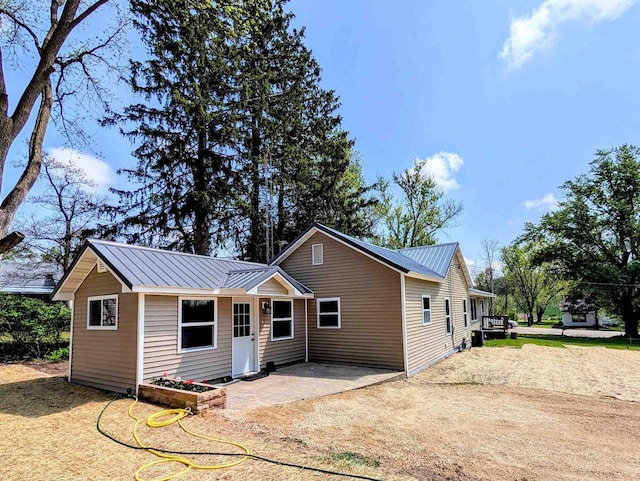 73 Church St, Montello, WI 53949 - rear view of house with metal roof