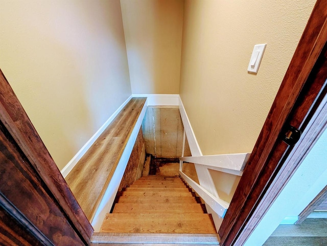 73 Church St, Montello, WI 53949 - stairway with wood finished floors and baseboards