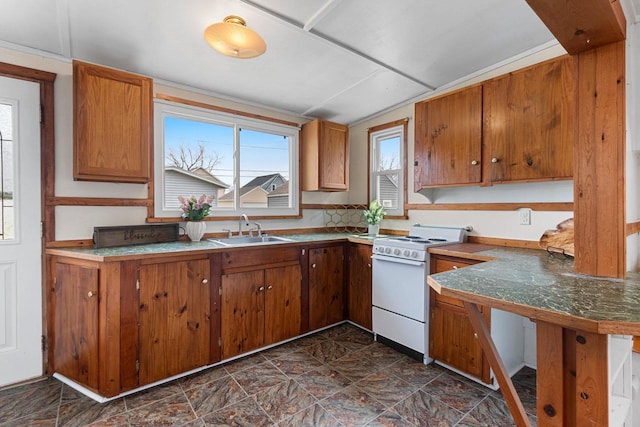 131 S Sidney St, Kimberly, WI 54136 - kitchen with white range oven, a sink, and brown cabinets