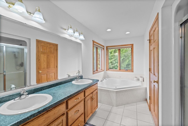 1500 Wolf Dr, West Bend, WI 53090 - bathroom with a stall shower, a bath, tile patterned floors, double vanity, and recessed lighting