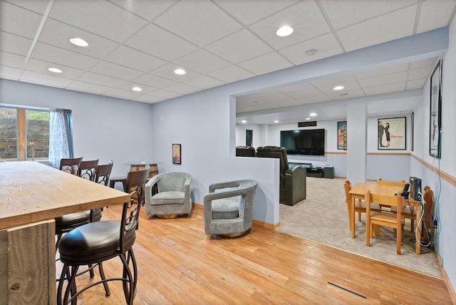 1500 Wolf Dr, West Bend, WI 53090 - living area with wood finished floors, baseboards, recessed lighting, and a paneled ceiling