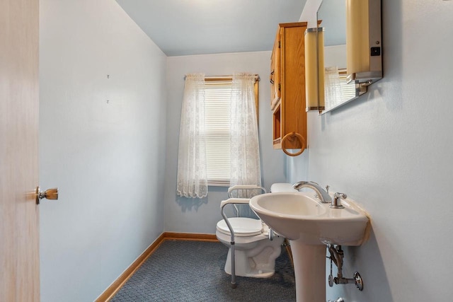 407 E Franklin St, Portage, WI 53901 - bathroom with toilet and baseboards