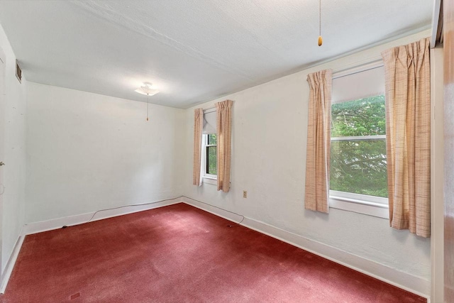 407 E Franklin St, Portage, WI 53901 - unfurnished room with dark carpet and baseboards
