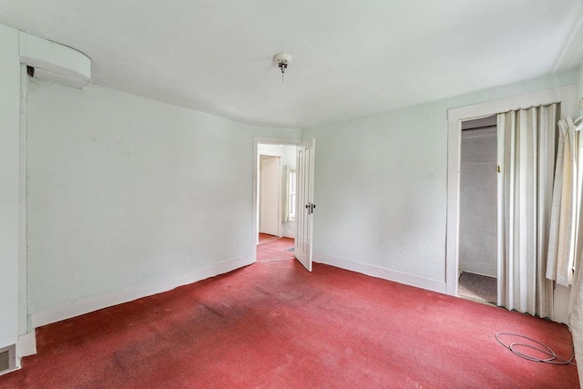 407 E Franklin St, Portage, WI 53901 - carpeted empty room featuring baseboards