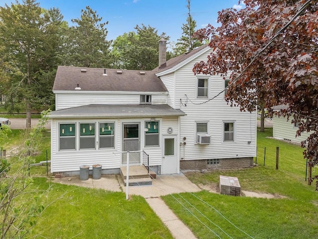 407 E Franklin St, Portage, WI 53901 - rear view of property featuring a shingled roof and cooling unit