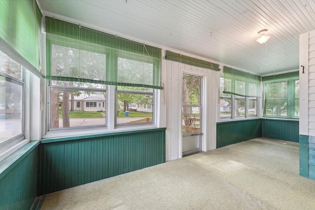 407 E Franklin St, Portage, WI 53901 - unfurnished sunroom featuring carpet flooring and wooden ceiling