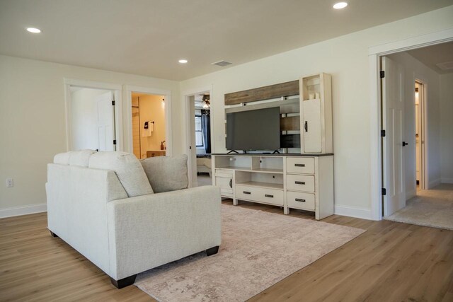 W5613 37th St, New Lisbon, WI 53950 - living area with light wood finished floors, baseboards, and recessed lighting