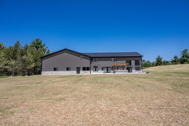 W5613 37th St, New Lisbon, WI 53950 - rear view of house with a lawn and metal roof
