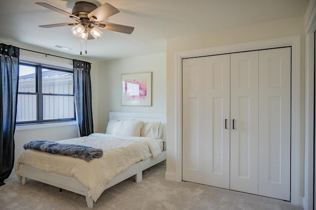 W5613 37th St, New Lisbon, WI 53950 - bedroom with light carpet, a closet, and a ceiling fan