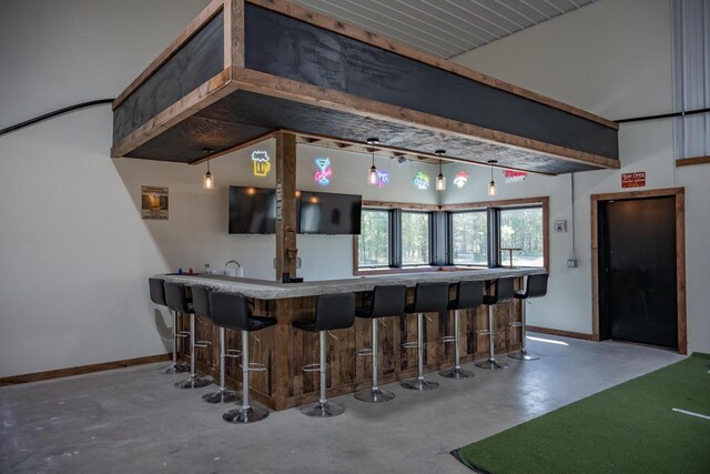 W5613 37th St, New Lisbon, WI 53950 - indoor wet bar with concrete flooring and baseboards