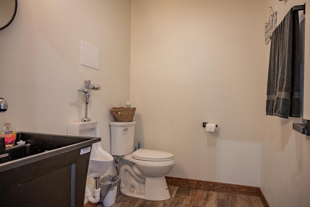 W5613 37th St, New Lisbon, WI 53950 - bathroom with wood finished floors, baseboards, toilet, and vanity