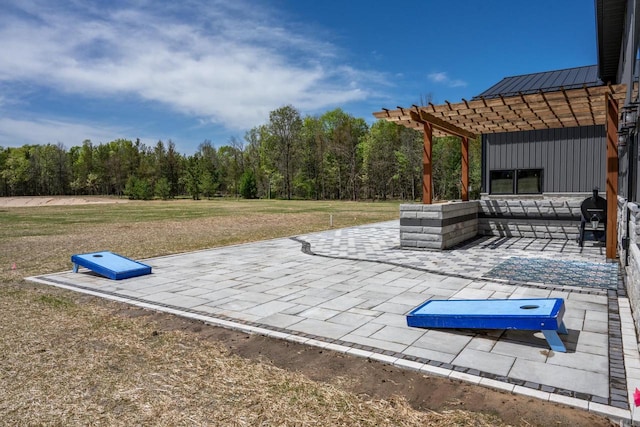 W5613 37th St, New Lisbon, WI 53950 - view of patio featuring a pergola and a forest view
