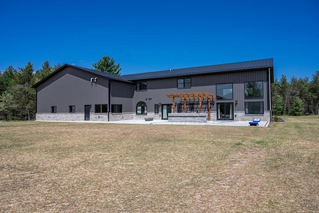 W5613 37th St, New Lisbon, WI 53950 - back of house with a pergola, a yard, a patio, and metal roof