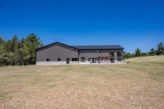 W5613 37th St, New Lisbon, WI 53950 - back of property featuring a lawn and metal roof
