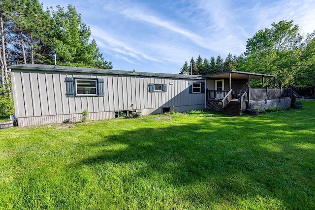 N5172 County Road O, Bruce, WI 54819 - view of front of home with a front lawn and a wooden deck