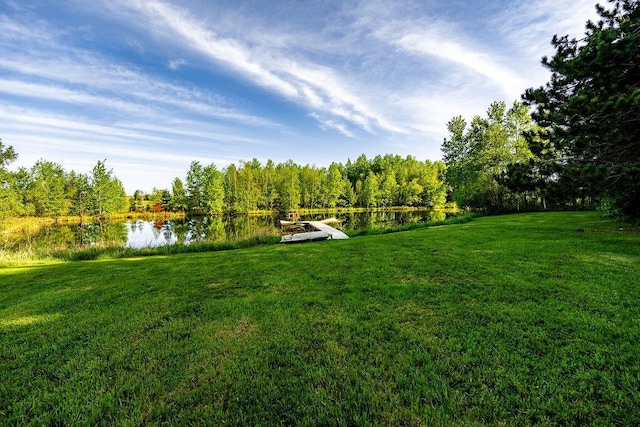 N5172 County Road O, Bruce, WI 54819 - view of green lawn featuring a water view and a wooded view