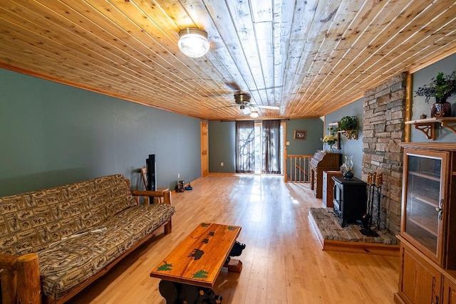 N5172 County Road O, Bruce, WI 54819 - living room with crown molding, wooden ceiling, ceiling fan, wood-type flooring, and a wood stove